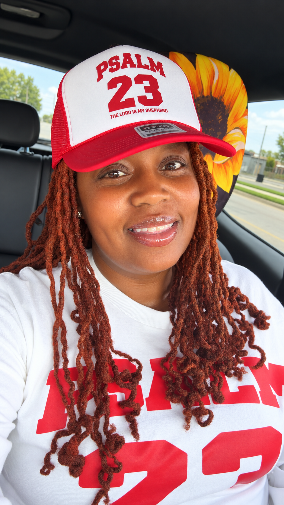 Bless It Hands founder wearing the Psalm 23 long-sleeve shirt and matching hat