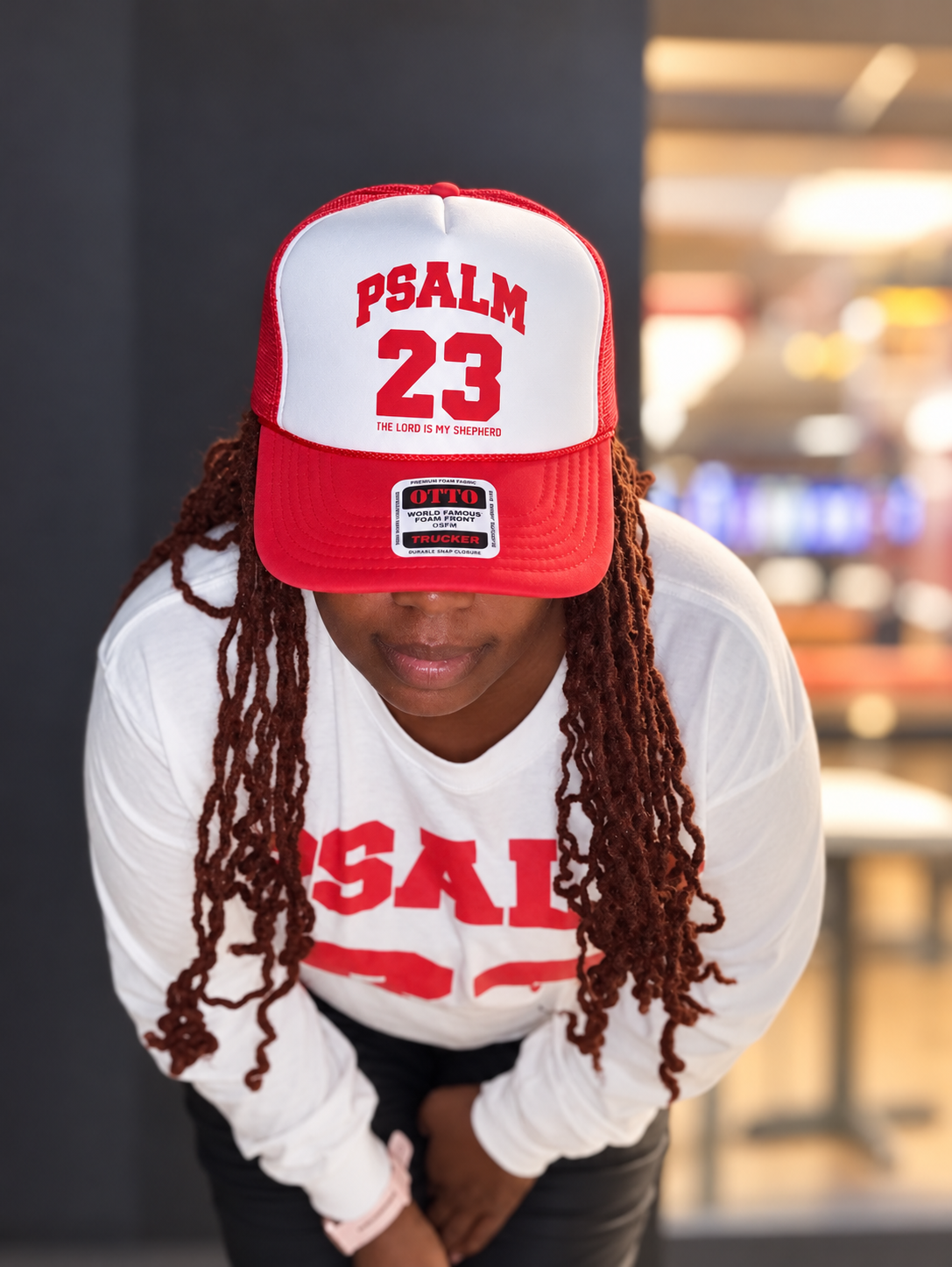 Psalm 23 red and white trucker hat front view lifestyle photo